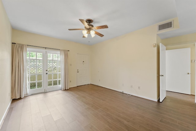 8055 Cambridge St Unit 21, Houston, TX 77054 - spare room featuring ceiling fan, wood finished floors, and baseboards