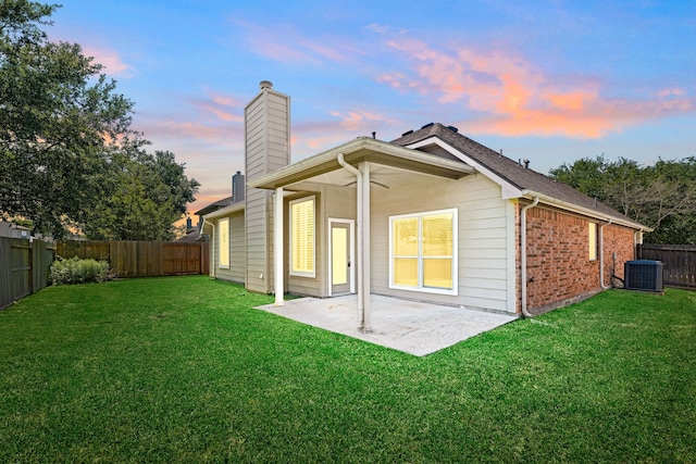 10446 Antelope Aly, Missouri City, TX 77459 - rear view of house with a chimney, a ceiling fan, a patio area, cooling unit, and brick siding