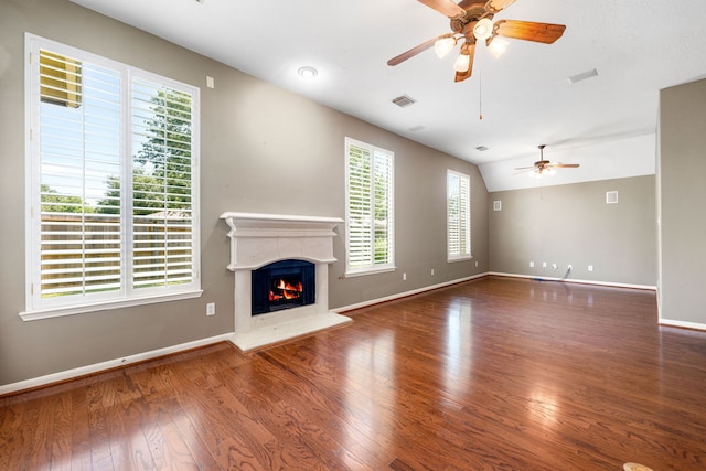 10446 Antelope Aly, Missouri City, TX 77459 - unfurnished living room with ceiling fan, wood finished floors, baseboards, and a lit fireplace