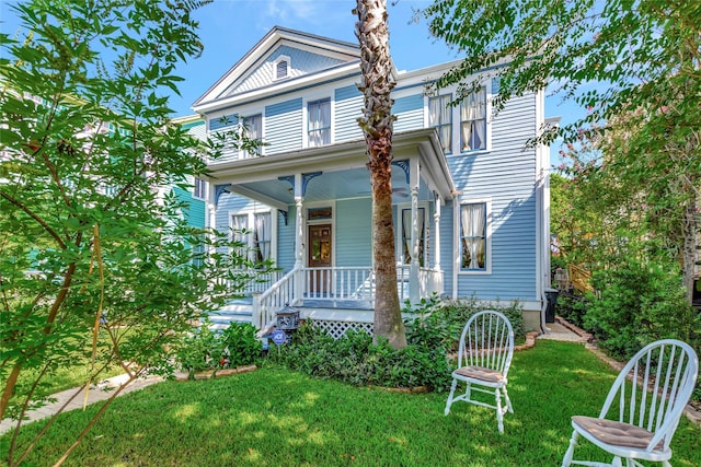 2608 Ursuline St, Galveston, TX 77550 - view of front of property featuring a porch and a front yard