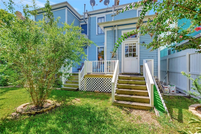 2608 Ursuline St, Galveston, TX 77550 - back of property featuring a wooden deck