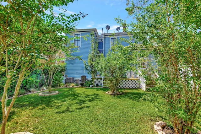 2608 Ursuline St, Galveston, TX 77550 - view of green lawn with central AC