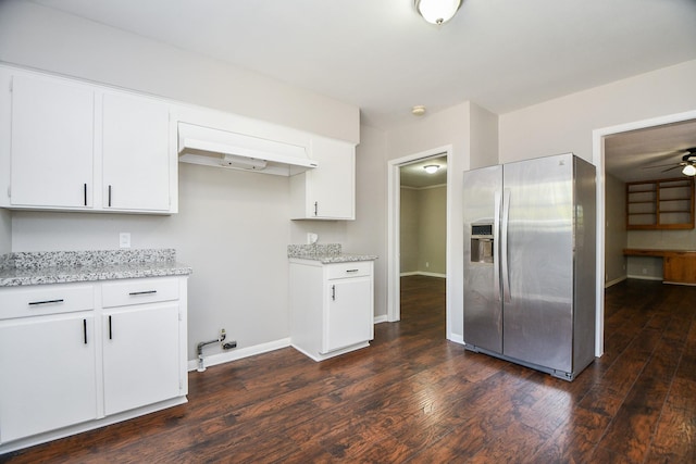 1225 Kirsten St, Galveston, TX 77568 - kitchen with stainless steel fridge, dark wood-style flooring, white cabinetry, and a ceiling fan