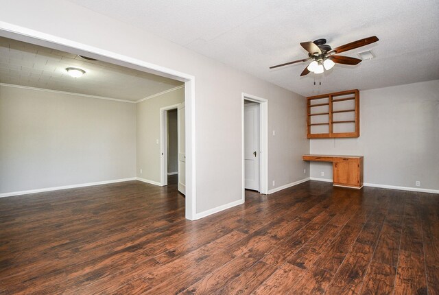 1225 Kirsten St, Galveston, TX 77568 - unfurnished living room featuring ceiling fan, dark wood-style flooring, crown molding, and baseboards