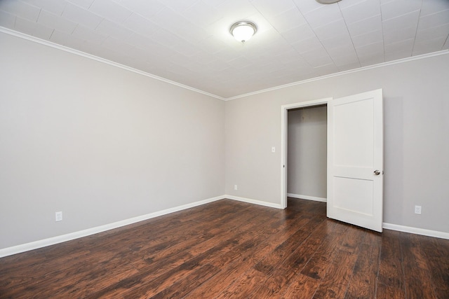 1225 Kirsten St, Galveston, TX 77568 - spare room featuring crown molding, dark wood finished floors, and baseboards