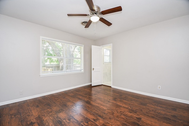 1225 Kirsten St, Galveston, TX 77568 - empty room with a ceiling fan, dark wood-style flooring, and baseboards