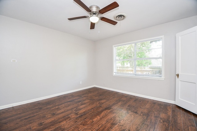 1225 Kirsten St, Galveston, TX 77568 - empty room featuring dark wood-type flooring, baseboards, and ceiling fan