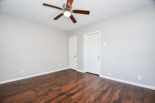 1225 Kirsten St, Galveston, TX 77568 - spare room featuring baseboards, dark wood-style flooring, and ceiling fan