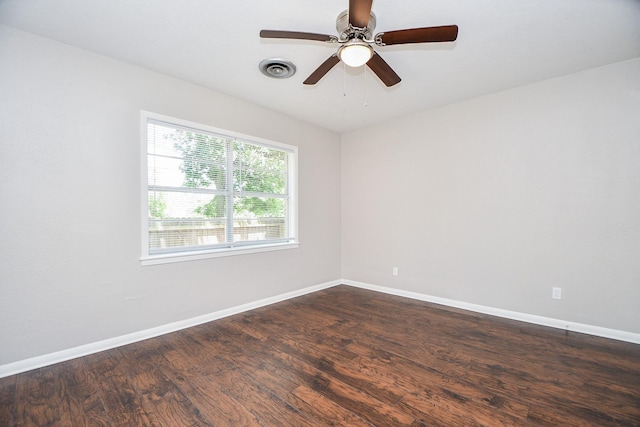 1225 Kirsten St, Galveston, TX 77568 - unfurnished room featuring dark wood-style floors, baseboards, and a ceiling fan