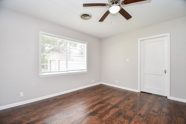 1225 Kirsten St, Galveston, TX 77568 - empty room featuring dark wood finished floors, baseboards, and ceiling fan