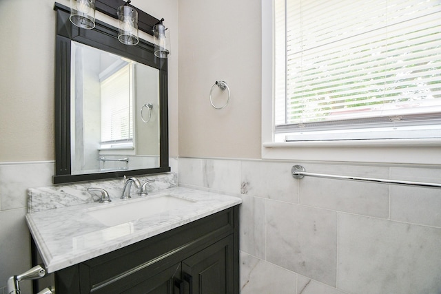 1225 Kirsten St, Galveston, TX 77568 - bathroom with tile walls, wainscoting, and vanity