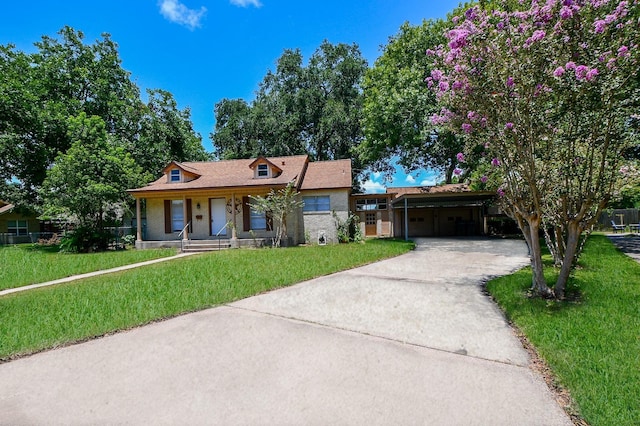 1225 Kirsten St, Galveston, TX 77568 - view of front of house with concrete driveway, an attached carport, a front yard, covered porch, and brick siding