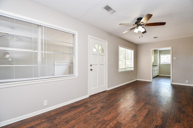 1225 Kirsten St, Galveston, TX 77568 - foyer featuring ceiling fan, wood finished floors, and baseboards