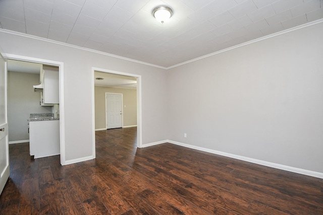 1225 Kirsten St, Galveston, TX 77568 - unfurnished living room featuring ornamental molding, dark wood-style floors, and baseboards