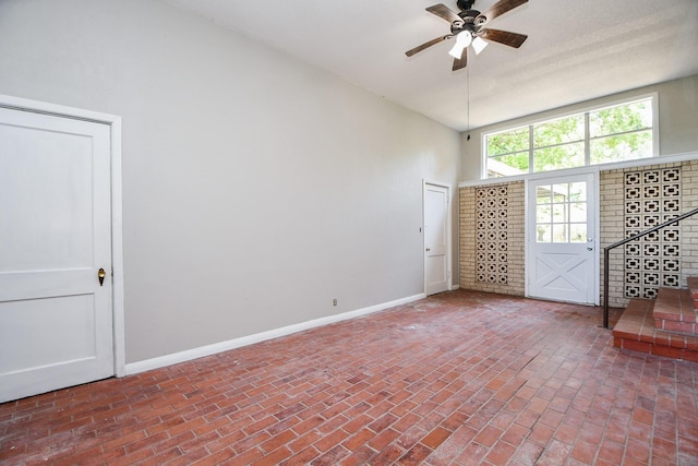 1225 Kirsten St, Galveston, TX 77568 - unfurnished room with brick floors, ceiling fan, and baseboards