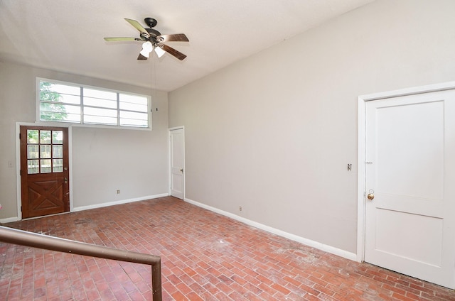 1225 Kirsten St, Galveston, TX 77568 - unfurnished room with brick flooring, a ceiling fan, and baseboards
