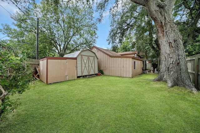 1225 Kirsten St, Galveston, TX 77568 - view of yard with a storage unit and an outbuilding