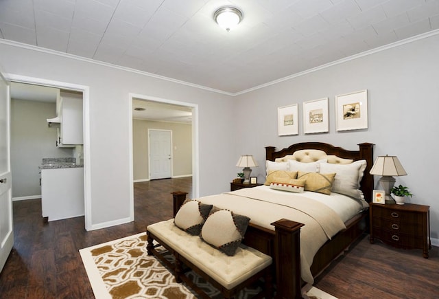 1225 Kirsten St, Galveston, TX 77568 - bedroom with dark wood finished floors, crown molding, and baseboards