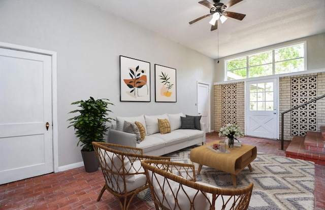 1225 Kirsten St, Galveston, TX 77568 - living room with ceiling fan, baseboards, and brick patterned floors