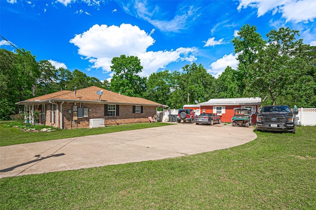 30926 Hilltop Ln, Magnolia, TX 77354 - view of front facade with driveway and brick siding