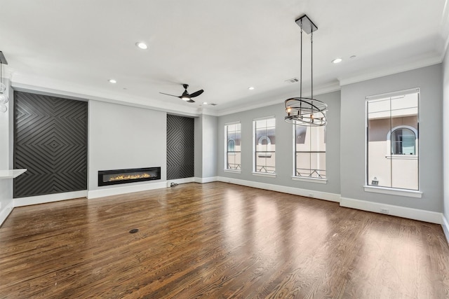 3302 Audley St Unit 110, Houston, TX 77098 - unfurnished living room with crown molding, a ceiling fan, recessed lighting, a glass covered fireplace, and baseboards