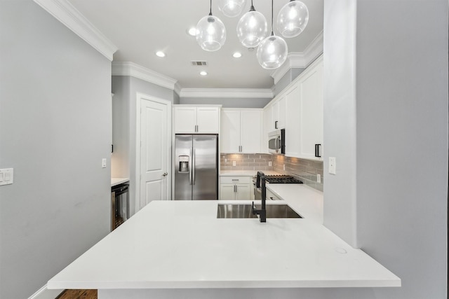 3302 Audley St Unit 110, Houston, TX 77098 - kitchen featuring stainless steel appliances, ornamental molding, a sink, light countertops, and backsplash