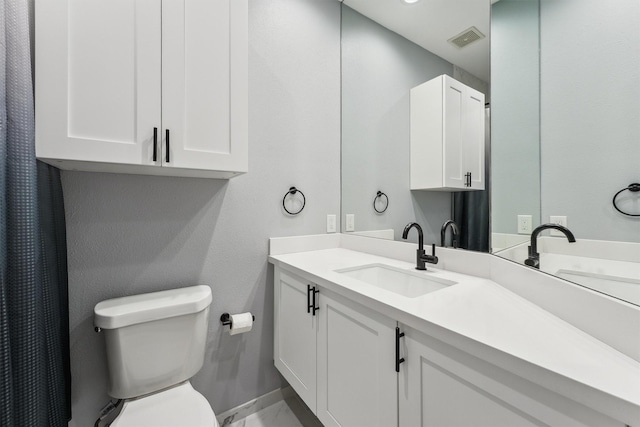 3302 Audley St Unit 110, Houston, TX 77098 - full bathroom with toilet, vanity, marble finish flooring, and baseboards
