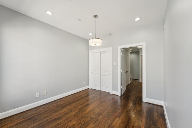 3302 Audley St Unit 110, Houston, TX 77098 - empty room with dark wood finished floors, baseboards, and recessed lighting