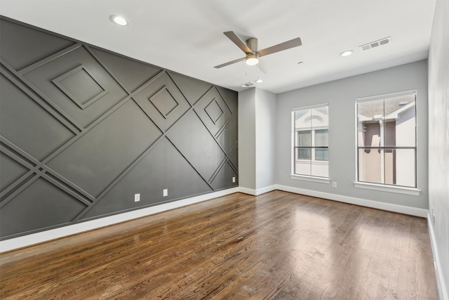3302 Audley St Unit 110, Houston, TX 77098 - spare room featuring baseboards, wood finished floors, a ceiling fan, and recessed lighting