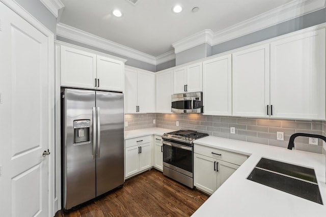 3302 Audley St Unit 110, Houston, TX 77098 - kitchen featuring appliances with stainless steel finishes, a sink, light countertops, recessed lighting, and white cabinets