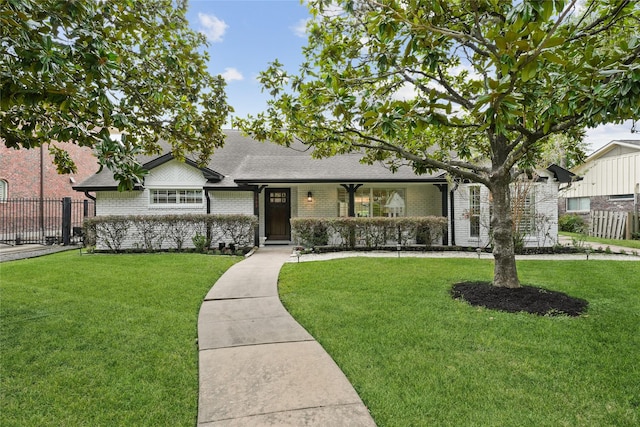 view of front of property featuring brick siding, a shingled roof, and a porch