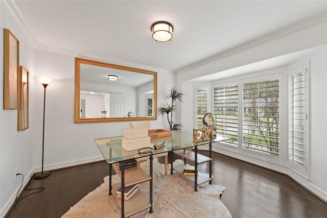 office area with baseboards, wood finished floors, and crown molding