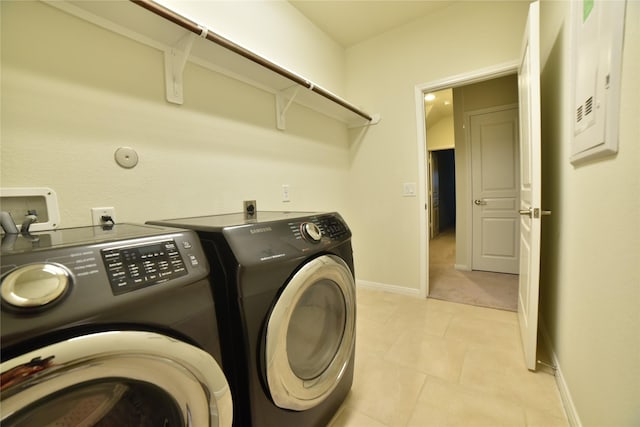 5118 Kingship Ct, Katy, TX 77493 - laundry room with washer and clothes dryer and baseboards
