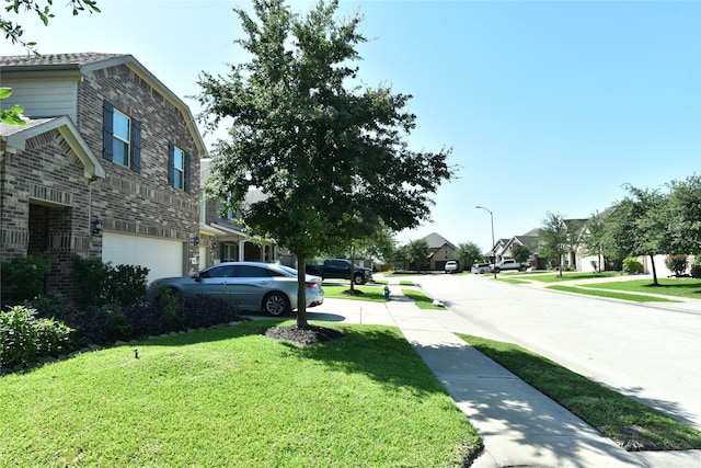 5118 Kingship Ct, Katy, TX 77493 - view of concrete street with sidewalks, street lights, and a residential view