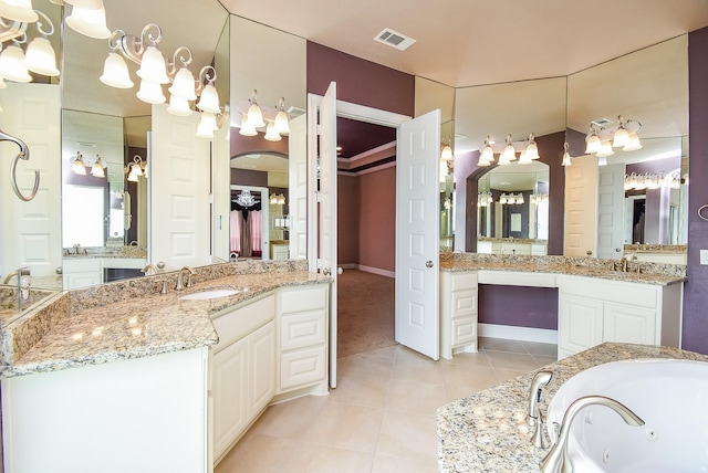 5450 Pudman River Ln, Sugar Land, TX 77479 - full bathroom featuring tile patterned floors, two vanities, a tub with jets, and baseboards