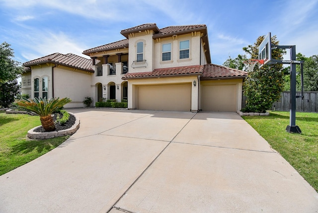 5450 Pudman River Ln, Sugar Land, TX 77479 - mediterranean / spanish-style home with a tile roof, stucco siding, driveway, a garage, and a balcony