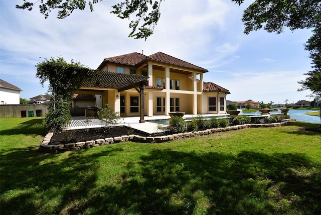 5450 Pudman River Ln, Sugar Land, TX 77479 - back of property with a tile roof, a patio, stucco siding, and a water view