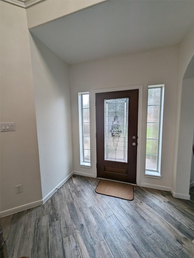 4202 Blue Sage Ter, Spring, TX 77388 - entrance foyer featuring wood finished floors, arched walkways, and baseboards