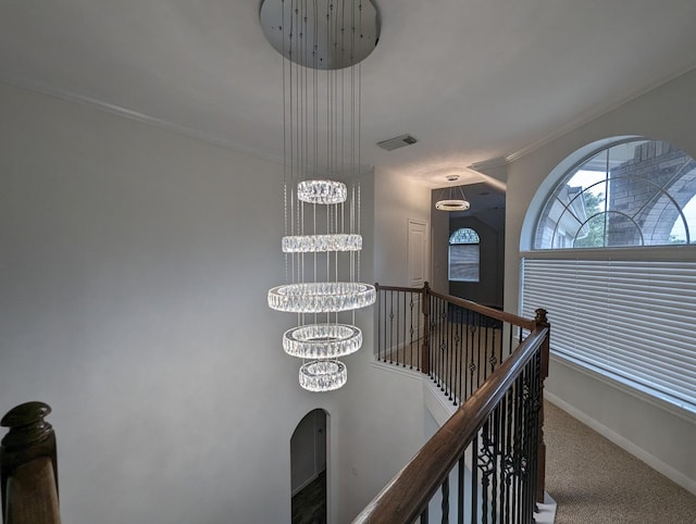 4202 Blue Sage Ter, Spring, TX 77388 - stairway featuring a chandelier, baseboards, ornamental molding, carpet flooring, and arched walkways