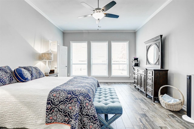 22015 Hanneck Ct, Katy, TX 77450 - bedroom featuring light wood-style flooring, baseboards, ornamental molding, and a ceiling fan
