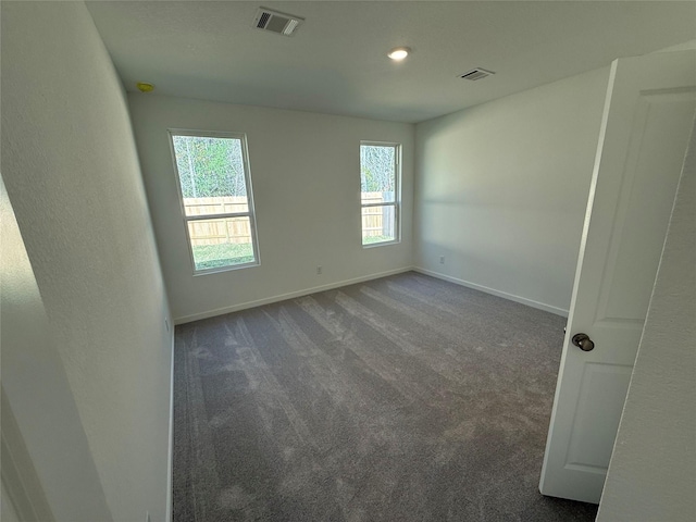 503 Shoreview Dr, Conroe, TX 77303 - unfurnished room featuring dark colored carpet and baseboards