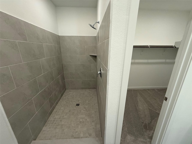 503 Shoreview Dr, Conroe, TX 77303 - bathroom with a tile shower and a spacious closet