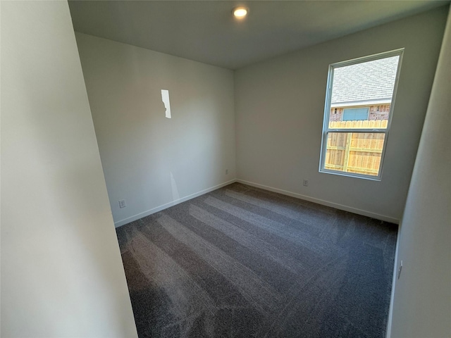503 Shoreview Dr, Conroe, TX 77303 - unfurnished room featuring dark colored carpet, baseboards, and recessed lighting