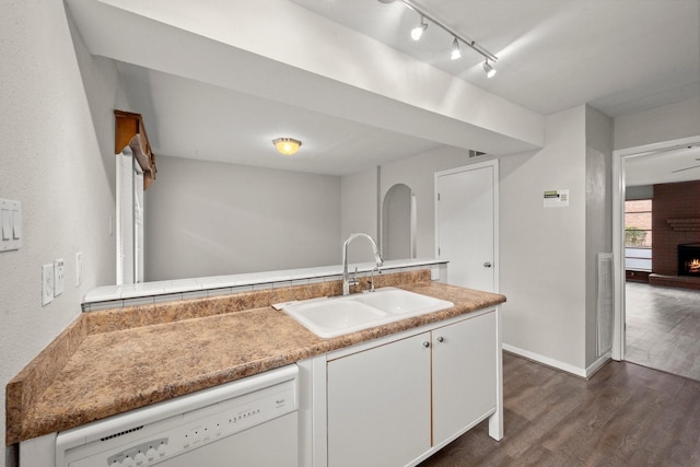 7736 Challie Ln, Houston, TX 77088 - kitchen featuring white dishwasher, a sink, dark wood finished floors, white cabinets, and light countertops