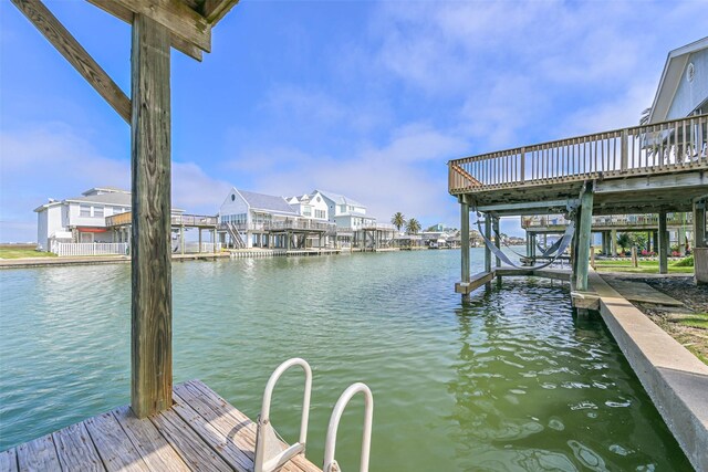 4606 Jamaica Cove Rd, Jamaica Beach, TX 77554 - dock featuring a water view and boat lift