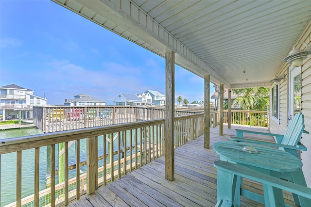 4606 Jamaica Cove Rd, Jamaica Beach, TX 77554 - wooden deck featuring a residential view and a water view