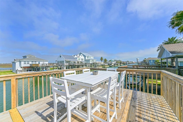 4606 Jamaica Cove Rd, Jamaica Beach, TX 77554 - wooden deck with outdoor dining space, a water view, and a residential view