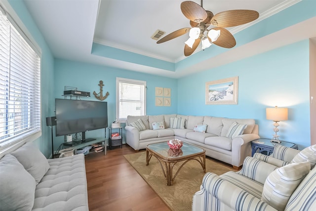 4606 Jamaica Cove Rd, Jamaica Beach, TX 77554 - living area with ornamental molding, wood finished floors, ceiling fan, and a tray ceiling