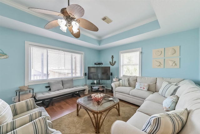 4606 Jamaica Cove Rd, Jamaica Beach, TX 77554 - living area with ornamental molding, wood finished floors, a ceiling fan, and a tray ceiling