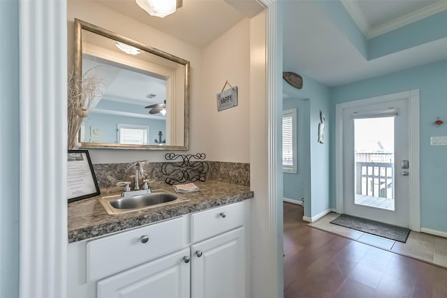 4606 Jamaica Cove Rd, Jamaica Beach, TX 77554 - bathroom featuring ornamental molding, baseboards, vanity, and tile patterned flooring